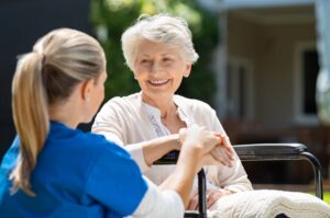 aging woman with caregiver