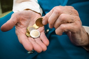 Aging woman counting money